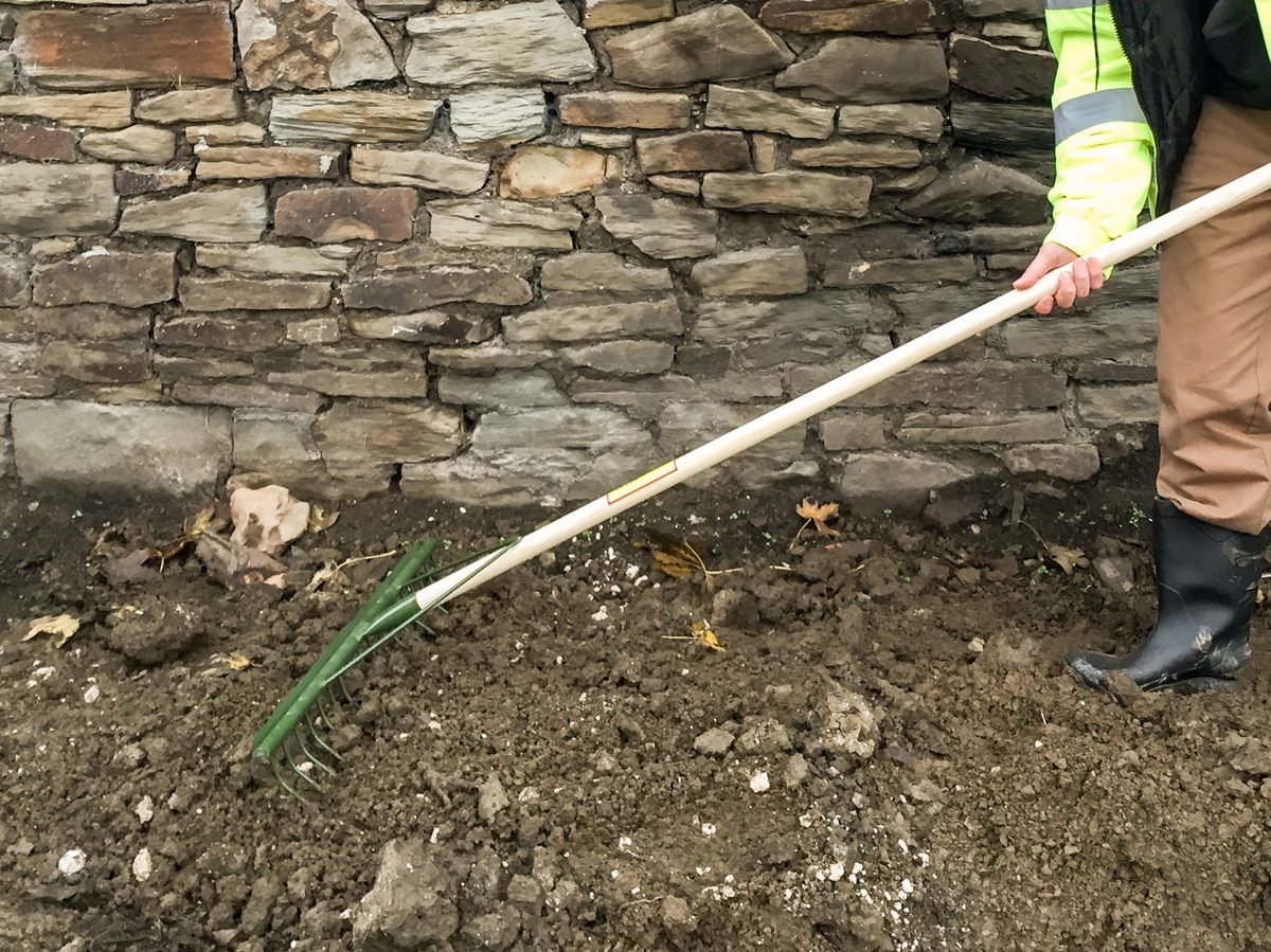 Chelwood® 18E® LANDSCRAPER® rake being used to work soil